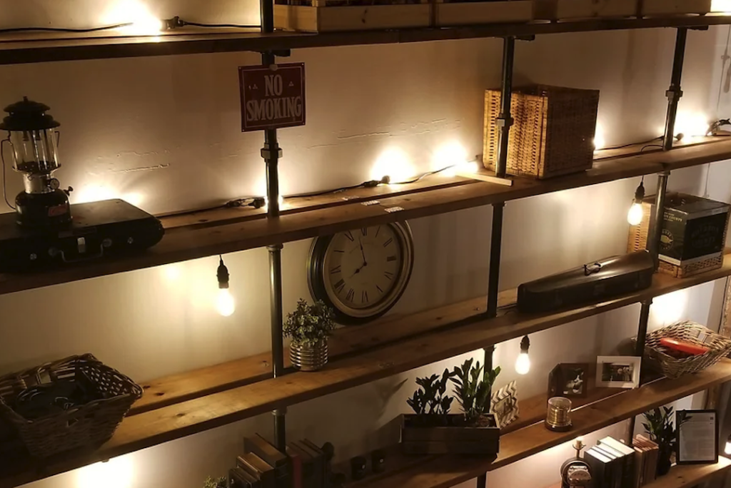 Rustic Wooden Shelf with Industrial Pipe Style and Built-In Light